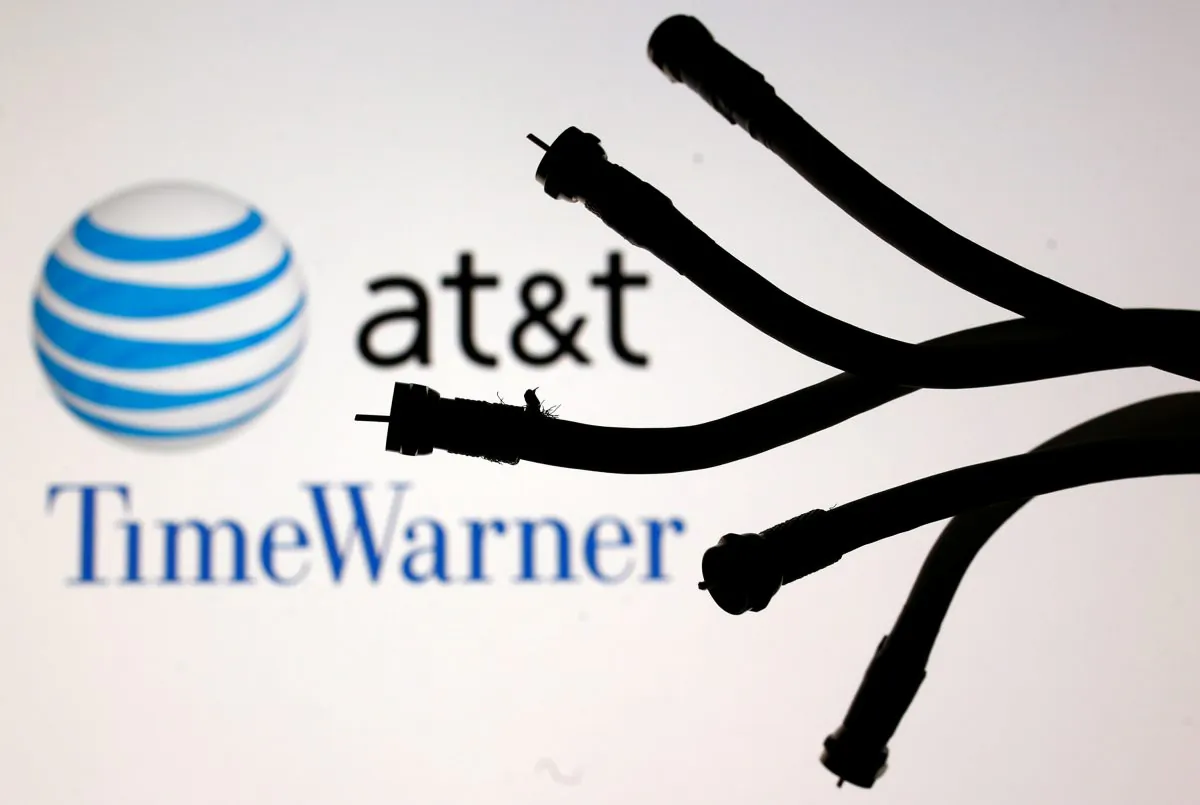 Coaxial TV Cables are seen in front of AT&T and Time Warner logos in this picture illustration taken on June 13, 2018. (Dado Ruvic/Illustration/Reuters)