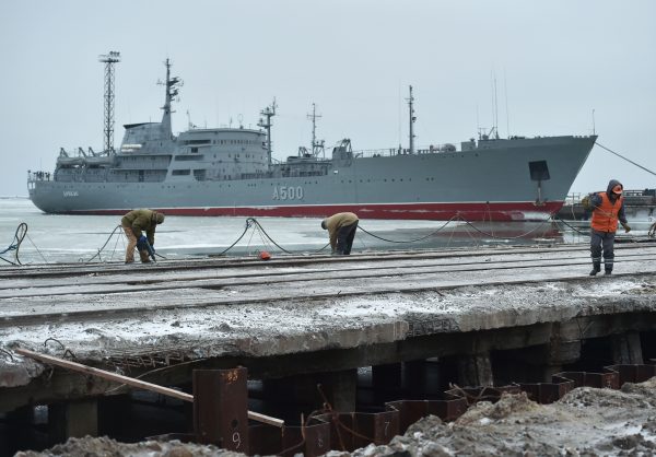 The Ukrainian command ship Donbass is seen moored as workers build new terminal at the Port of Mariupol on the Azov Sea, eastern Ukraine, on Dec. 2, 2018.