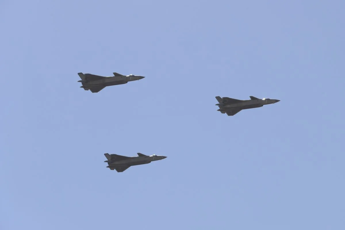 Chinese J-20 stealth fighter jets fly past during a military parade at the Zhurihe training base in China's northern Inner Mongolia region on July 30, 2017.
China held a parade of its armed forces on July 30 to mark the 90th anniversary of the People's Liberation Army (PLA). (STR/AFP/Getty Images)