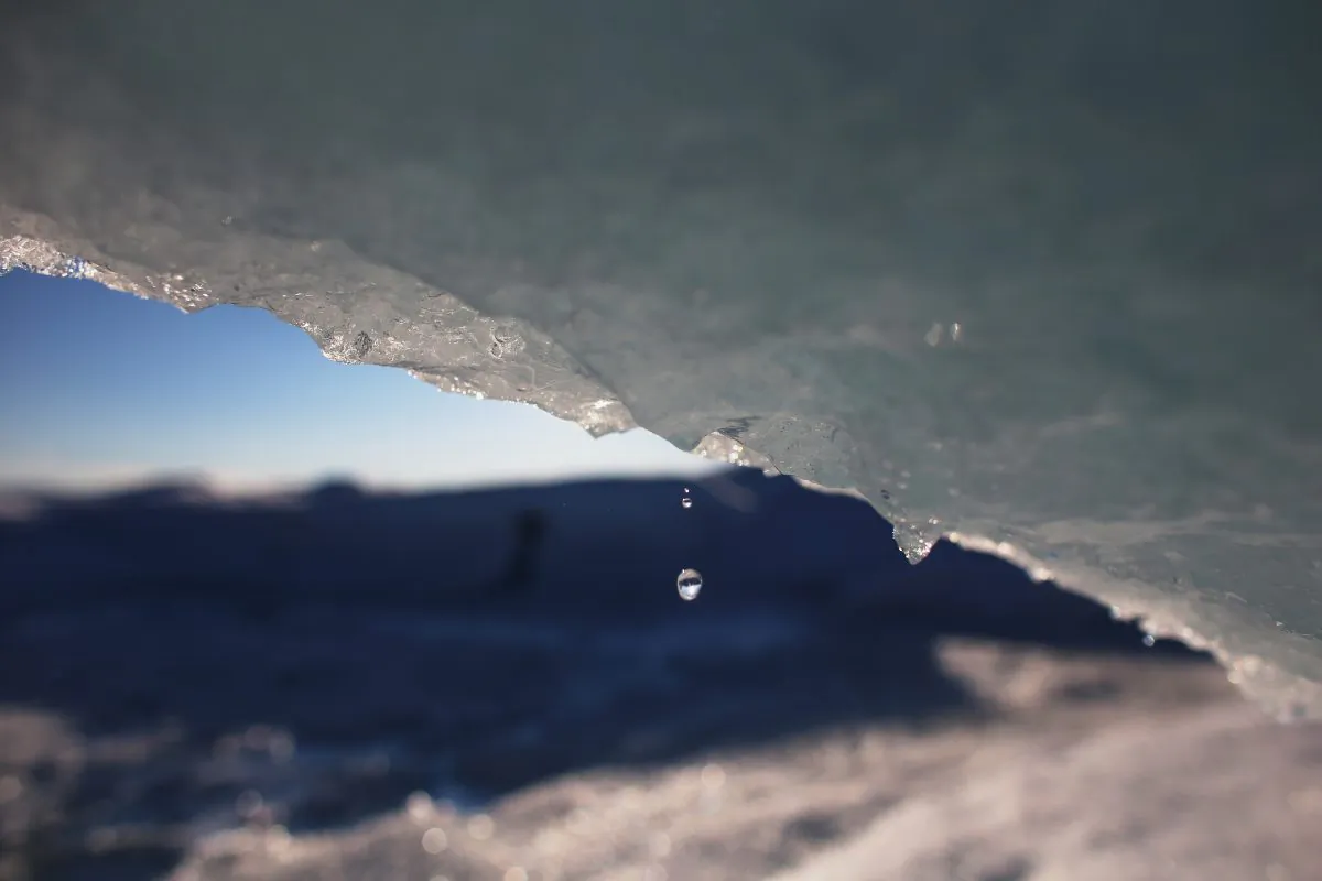 In this file photo, part of the glacial ice sheet that covers about 80 percent of the country is seen on July 17, 2013, on the Glacial Ice Sheet, Greenland. Are the polar ice caps growing or shrinking, and is it the result of human activity? Do we even need to ask this question anymore? (Joe Raedle/Getty Images)