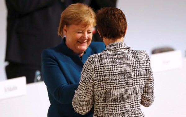 Annegret Kramp-Karrenbauer is congratulated by German Chancellor Angela Merkel