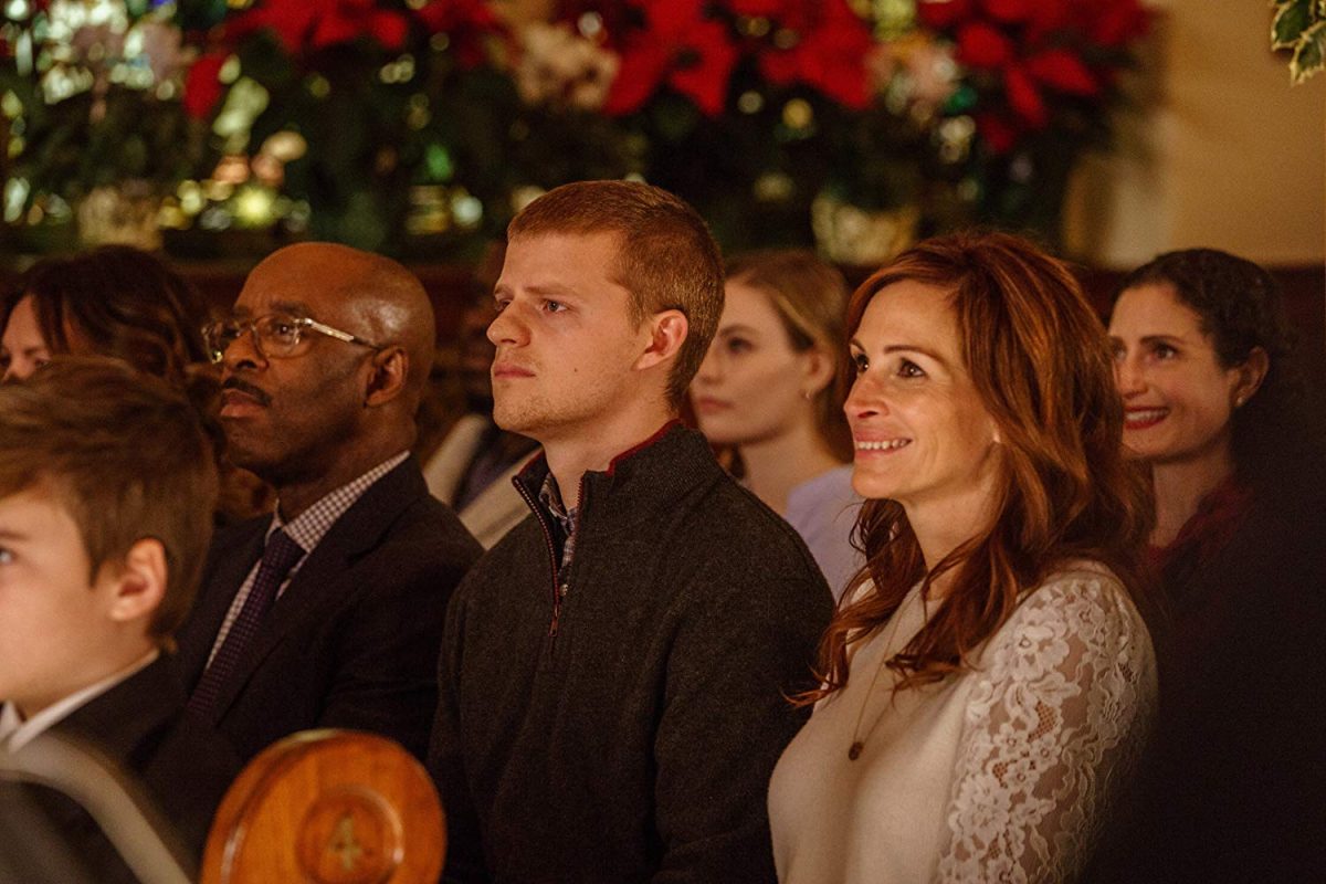 (L-R) Courtney B. Vance, Lucas Hedges, Julia Roberts sit in church