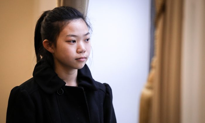 Xinyang Xu, a 17 year old girl whose father died as a result of the torture he endured in China because of his belief in Falun Gong, poses after speaking at the Deteriorating Human Rights and Tuidang Movement in China forum, at Congress in Washington on Dec. 4, 2018. (Samira Bouaou/The Epoch Times)