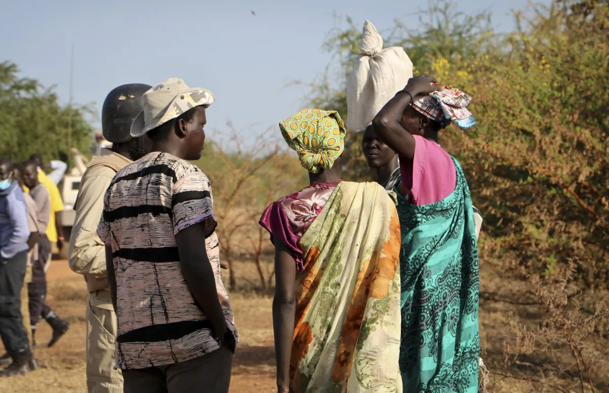 Women and girls speak to members of a UN peacekeeping patrol as they walk to get food in South Sudan, Dec. 7, 2018. (Sam Mednick/AP)