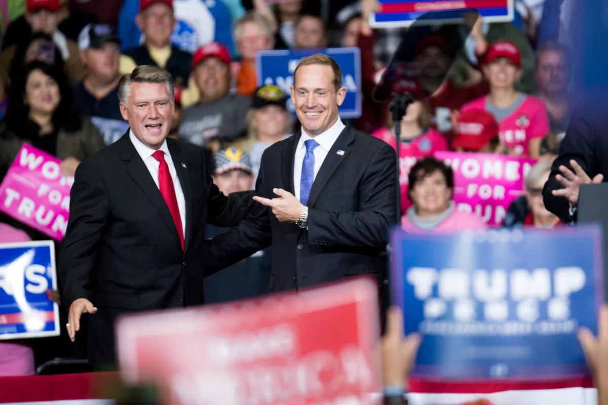 Republican Congressional candidate for North Carolina's 13th district Ted Budd (R), and 9th district Mark Harris (L) are introduced by President Donald Trump during a campaign rally at the Bojangles Coliseum on October 26, 2018 in Charlotte, North Carolina. (Sean Rayford/Getty Images)