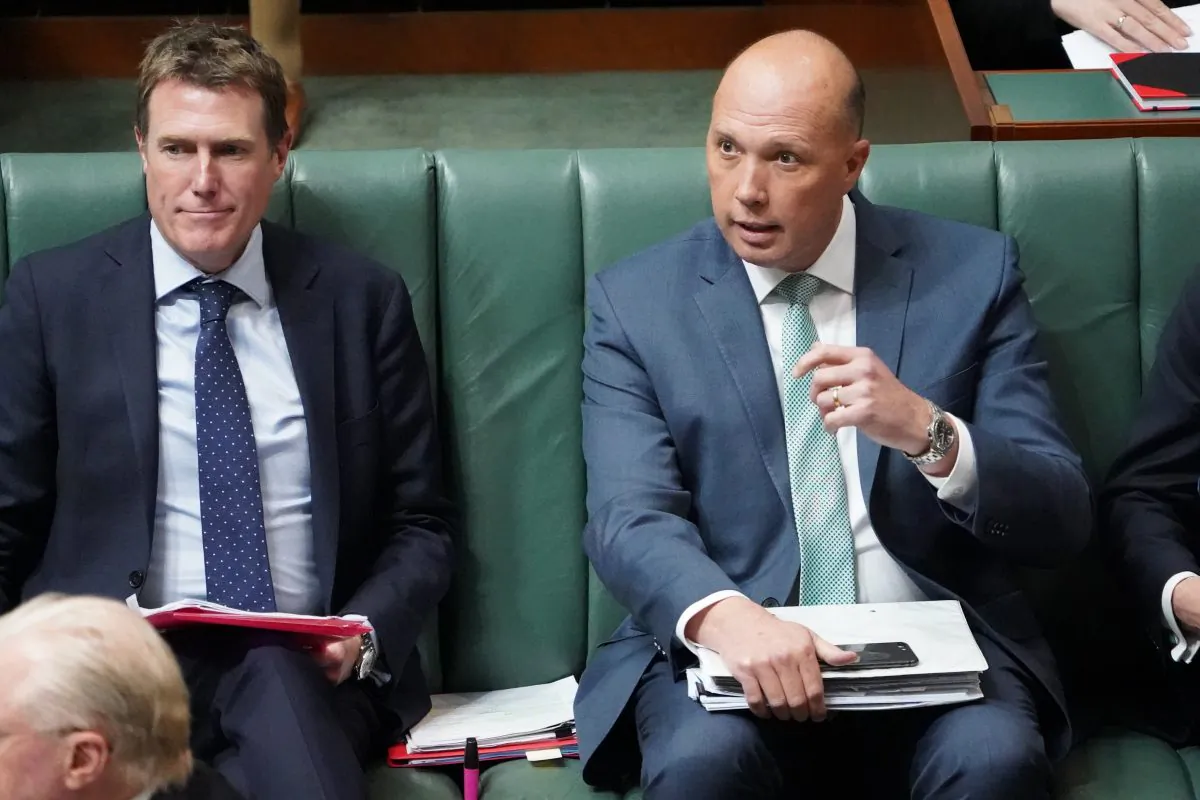 Australia's Attorney-General, Christian Porter (L), and Minister for Home Affairs Peter Dutton are seen during Question Time in the House of Representatives at Parliament House in Canberra, Australia, on Sept. 13, 2018. (Stefan Postles/Getty Images)
