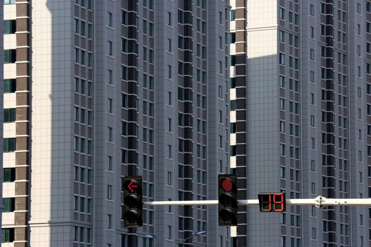 Traffic lights are seen in front of residential buildings in Huaian, Jiangsu Province, China on Oct. 6, 2018. (Reuters)
