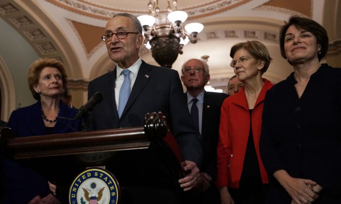 U.S. Senate Minority Leader Sen. Chuck Schumer (D-NY) speaks to members of the media as (L-R) Sen. Debbie Stabenow (D-MI), Sen. Bernie Sanders (I-VT), Senate Minority Whip Sen. Richard Durbin (D-IL), Sen. Elizabeth Warren (D-MA), and Sen. Amy Klobuchar (D-MN) look on after a leadership election at the U.S. Capitol in Washington, on Nov. 18, 2018. (Alex Wong/Getty Images)