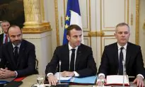 Macron Vows Tax Relief, Urges Calm in Bid to Quell Protests