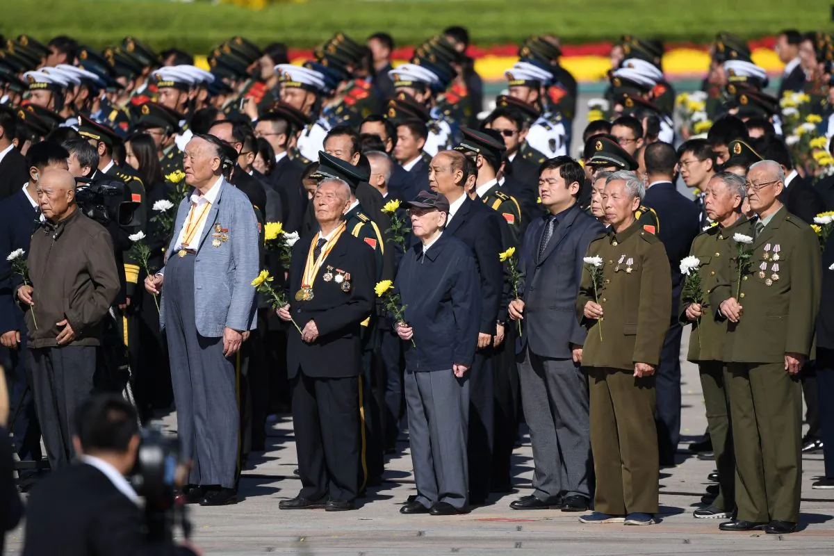 Veterans stand during a ceremony in Beijing's Tiananmen Square, on the eve of National Day on Sept. 30, 2018. (Greg Baker/AFP/Getty Images)