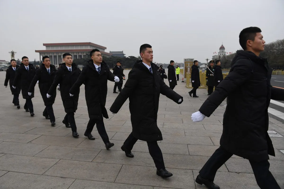 Security personnel patrol in Tiananmen Square ahead of a vote on constitutional amendments at the National People's Congress in Beijing on March 11, 2018.
China's rubber-stamp parliament is set on March 11, to hand President Xi Jinping free rein to rule the rising Asian superpower indefinitely, with potential abstentions offering the only suspense in the historic vote. / AFP PHOTO / GREG BAKER        (Photo credit should read GREG BAKER/AFP/Getty Images)