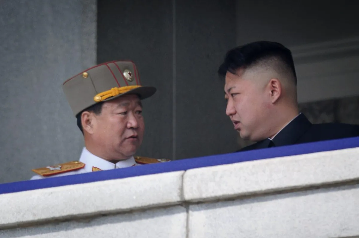 Choe Ryong Hae (L) talks with North Korean leader Kim Jong Un during a military parade in Pyongyang on April 15, 2012. (AFP/AFP/Getty Images)