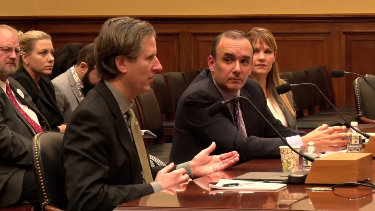 (L-R) Jeffery Morehouse, the father of a son abducted to Japan, speaks on a panel with Juan Garaicoa, the father of two children taken to Ecuador by their mother, and Michelle Littleton, a mother of three who were taken to Lebanon by their father, at a House Foreign Affairs subcommittee hearing on "Reviewing International Child Abduction" in Washington, on Dec. 10, 2018. (NTD/York Du)