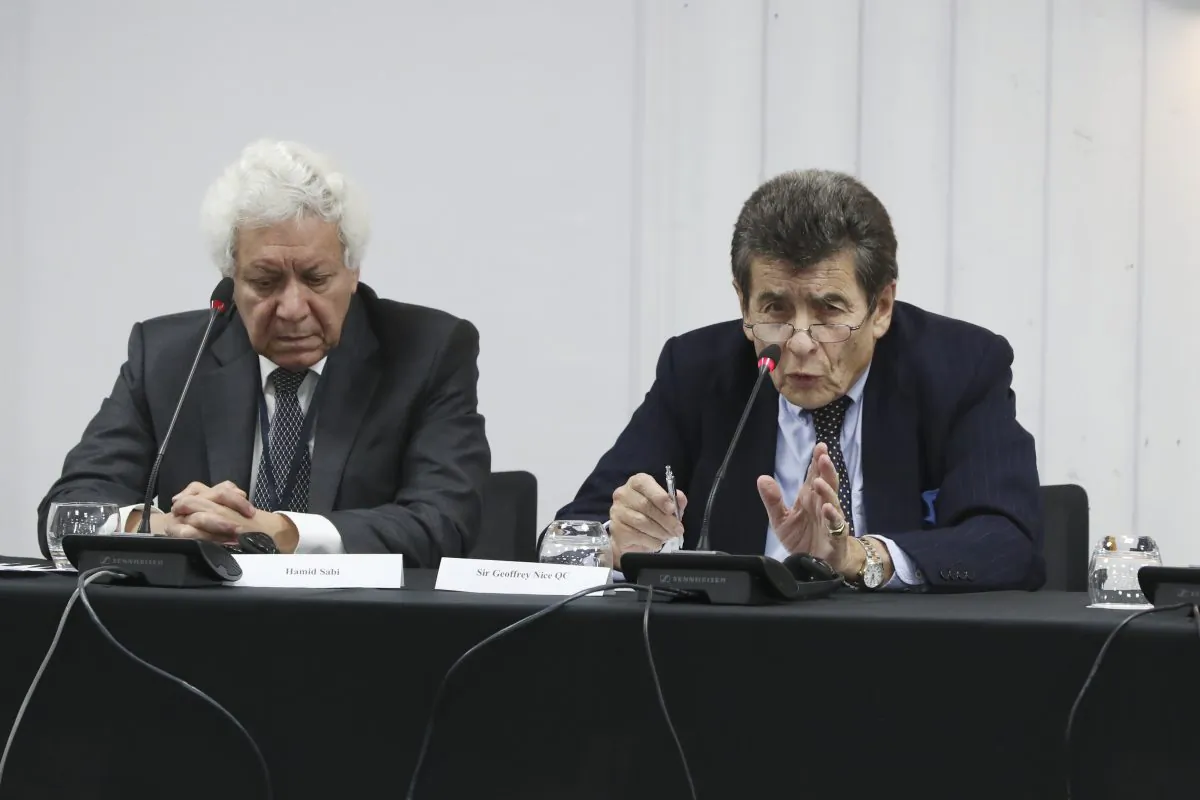 Legal counsel to the tribunal Hamid Sabi and chair to the tribunal Sir Geoffrey Nice QC on the first day of public hearings in London on Dec. 8, 2018. (Justin Palmer)