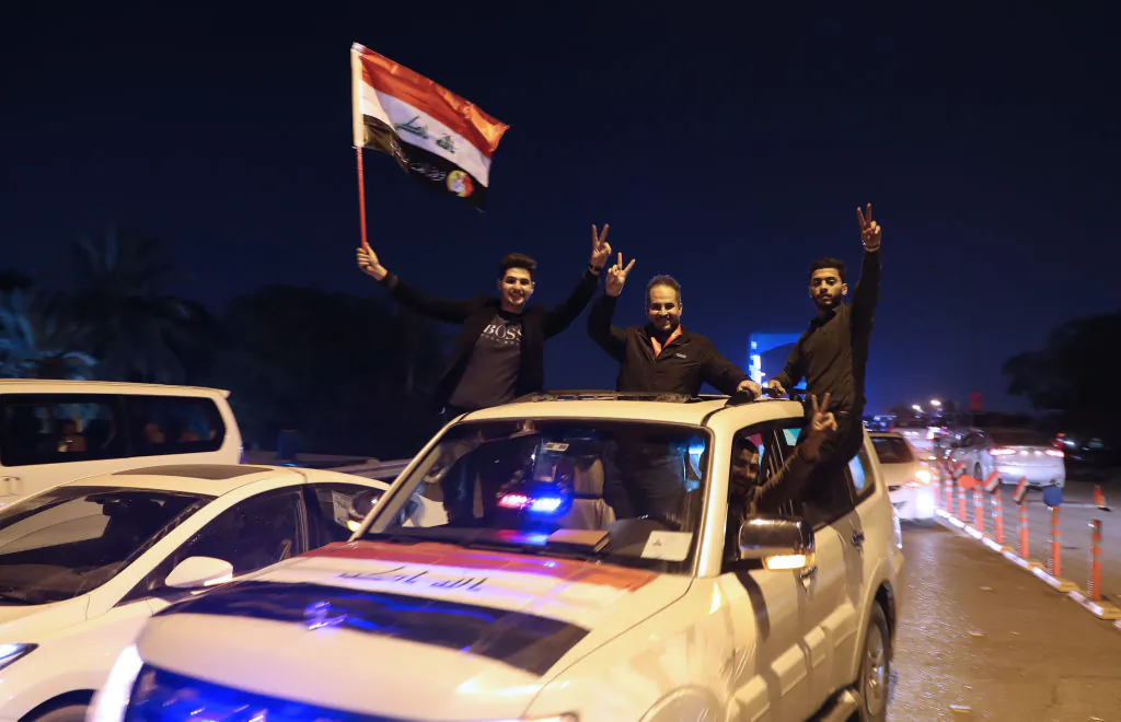 Iraqis celebrate the re-opening of the Green Zone, home to government buildings and Western embassies, on Dec. 10, 2018 in the capital Baghdad. (Ahmad Al-Rubaye/AFP/Getty Images)