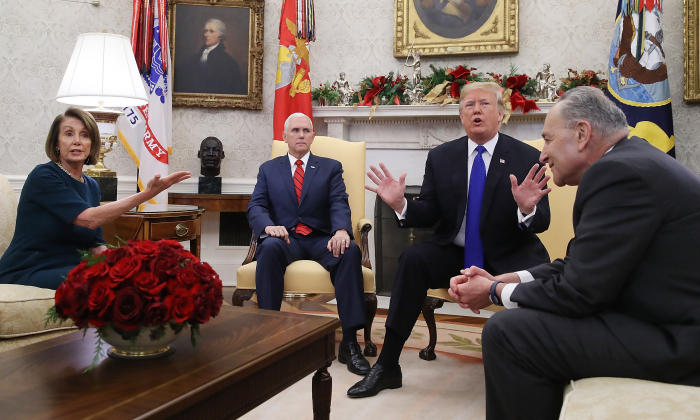 Vice President Mike Pence (second from left) listens while presumptive Speaker, House Minority Leader Nancy Pelosi (D-CA) (L), President Donald Trump, and Senate Minority Leader Charles Schumer (D-NY) argue before a meeting at the White House in Washington on Dec. 11, 2018. (Brendan Smialowski/AFP/Getty Images)
