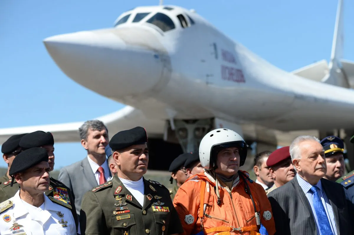 Venezuelan Defence Minister Vladimir Padrino (2L) is pictured after the arrival of two Russian Tupolev Tu-160 strategic long-range bombers at Maiquetia International Airport, just north of Caracas, on Dec. 10, 2018. (Federico Parra/AFP/Getty Images)