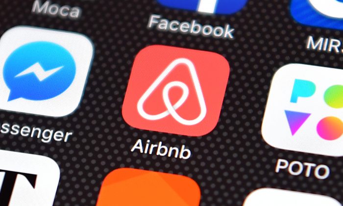 The Airbnb app logo is displayed on an iPhone on Aug. 3, 2016. (Carl Court/Getty Images)