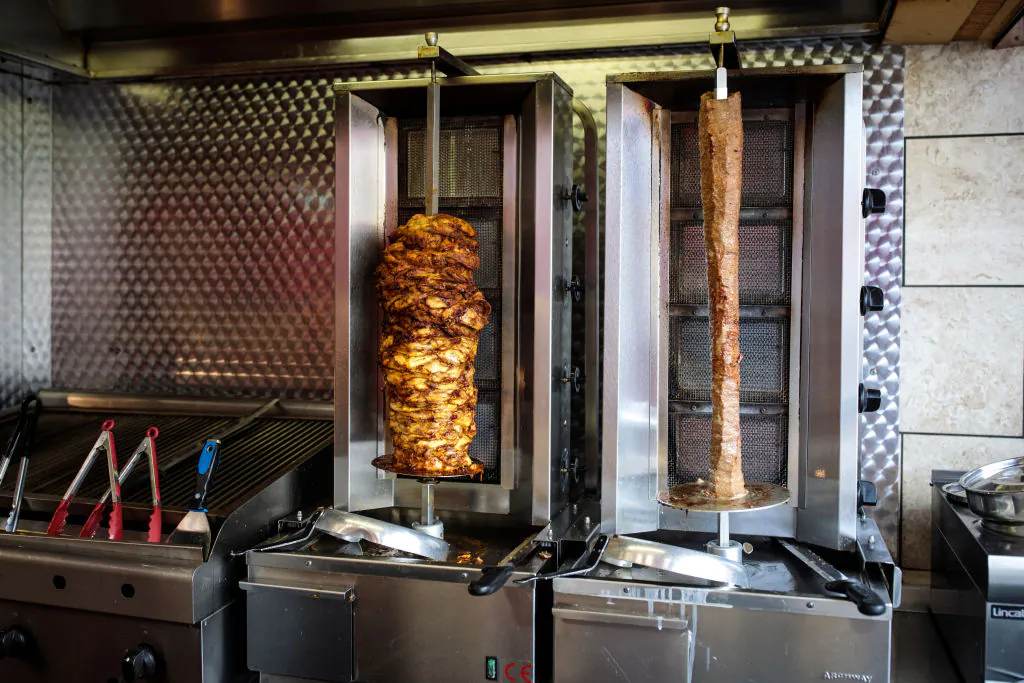 Doner kebabs sit on a rotisserie in a fast food shop in London on April 26, 2018. (Jack Taylor/Getty Images)