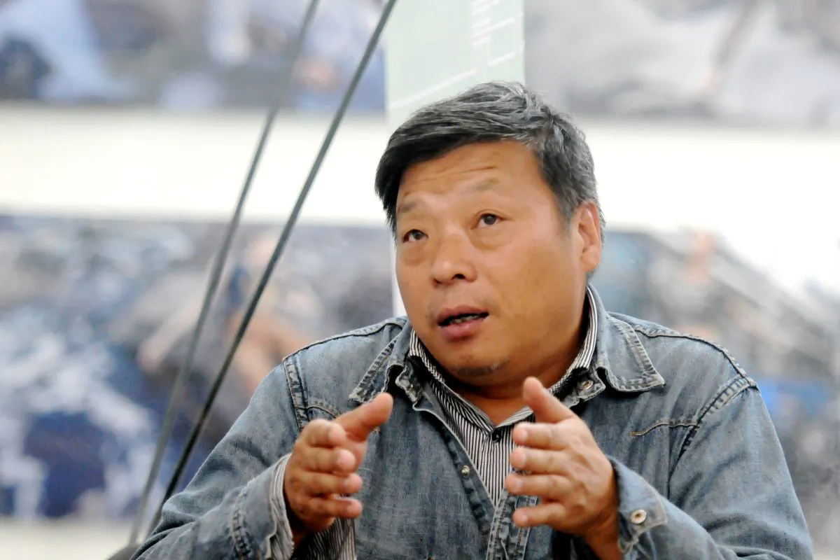 Chinese photographer Lu Guang attends the Pingyao International Photography (PIP) Festival in Pingyao, Shanxi Province, China on Sept. 20, 2014. (Reuters)