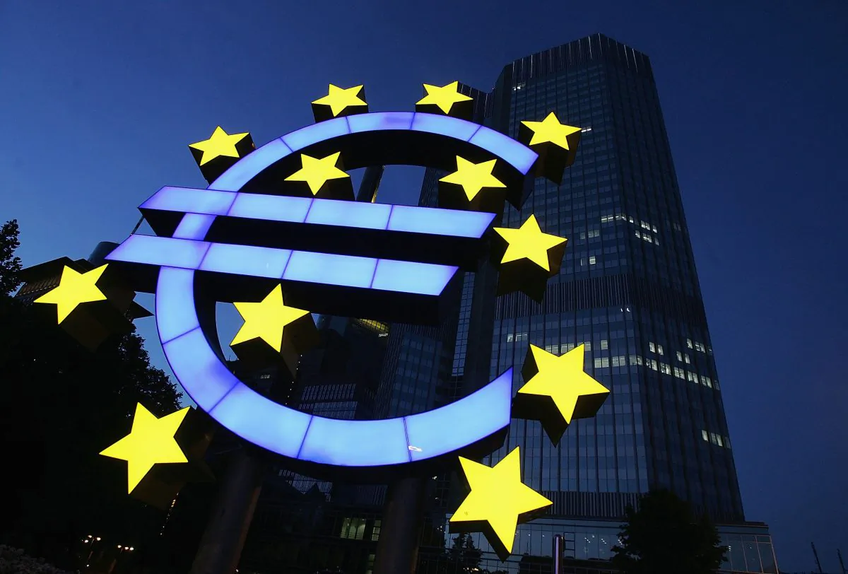 In this file photo a huge euro logo is seen in front of the headquarters of the European Central Bank (ECB) on June 13, 2005, in Frankfurt, Germany. The replacement of the national currency with a single euro was a political attempt to integrate the very different nations of the EU, according to some commentators. (Ralph Orlowski/Getty Images)