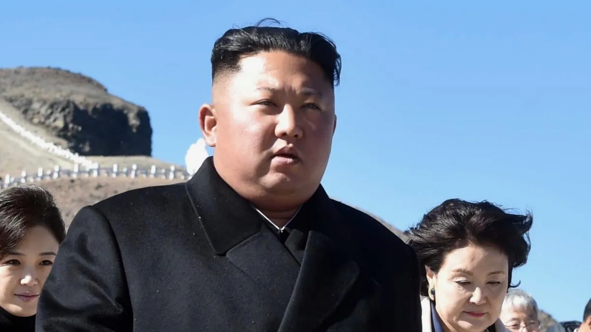 North Korean leader Kim Jong Un talks with South Korean President Moon Jae-in as they visit on the top of Mount Paektu in Mount Paektu, North Korea on Sept. 20, 2018. (Pyeongyang Press Corps/Pool/Getty Images)