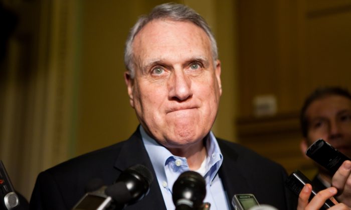 Sen. Jon Kyl (R-AZ), a member of the Joint Select Committee on Deficit Reduction, also known as the super committee, talks with reporters outside his office in the U.S. Capitol in Washington on Nov. 19, 2011. (Brendan Hoffman/Getty Images)