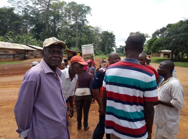 Locals gather at the village square in Edjom in south of Cameroon on Nov. 18, 2018, to discuss Sudcam’s rubber expansion project which they say is impacting their lives. (By Amindeh Blaise Atabong/Special to The Epoch Times)