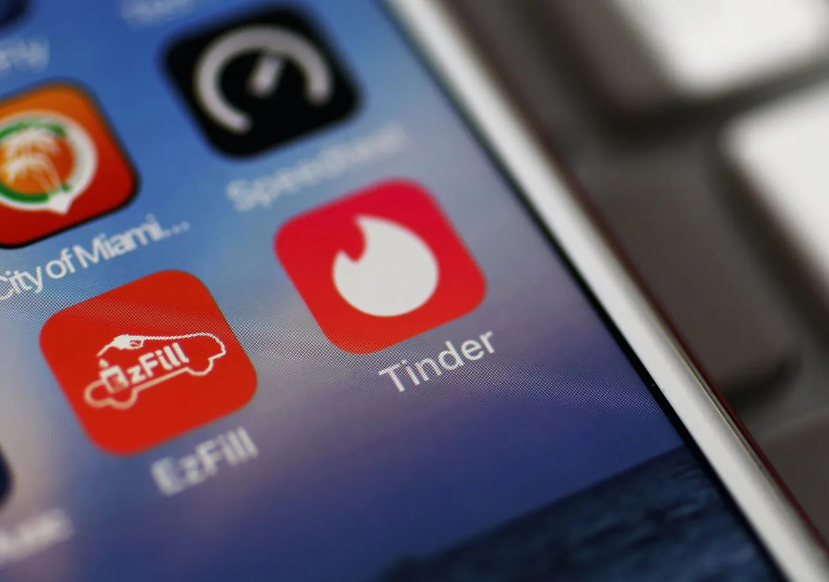 The icon for the dating app Tinder is seen on the screen of an iPhone in Miami, Florida on Aug. 14, 2018. (Joe Raedle/Getty Images)