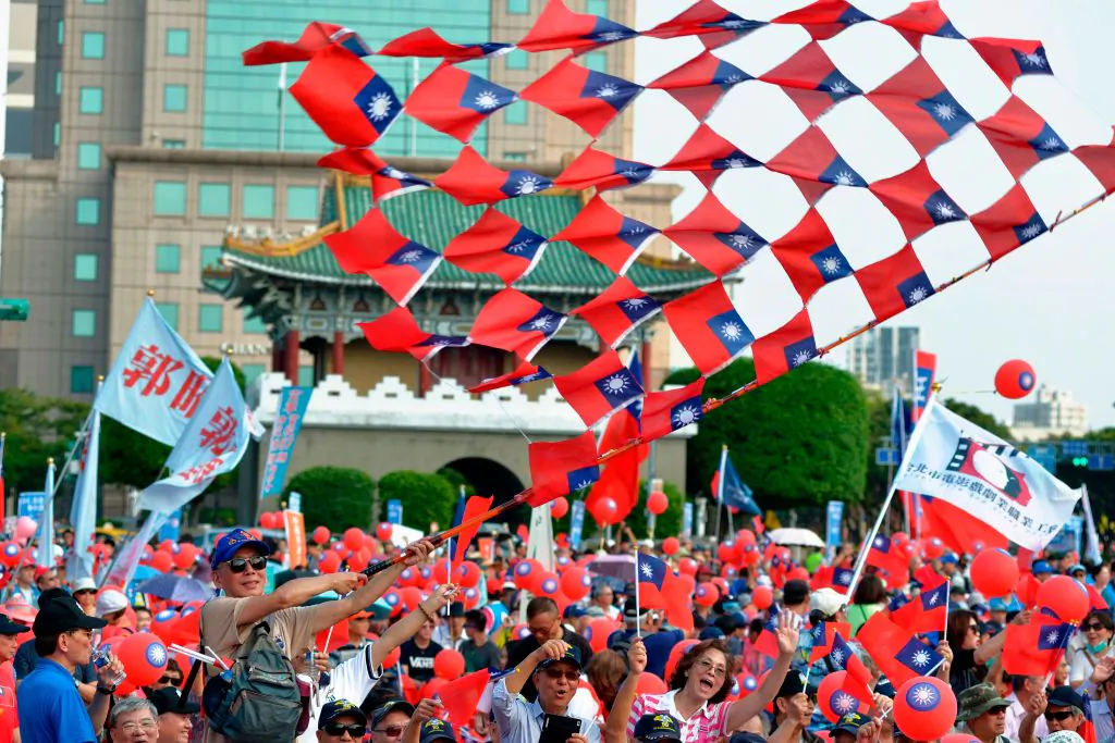 Supporters of mayoral candidate Ting Shou-chung from the opposition Kuomintang party attend a campaign rally in Taipei on Nov. 11, 2018. He is seeking to contest election results that placed the incumbent as the winner. (Chris Stowers/AFP/Getty Images)