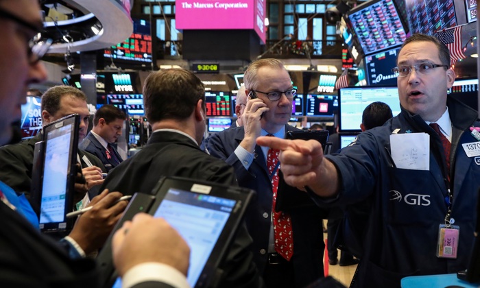 Traders work on the floor of the New York Stock Exchange in New York on Dec. 14, 2018. (Brendan McDermid/Reuters)