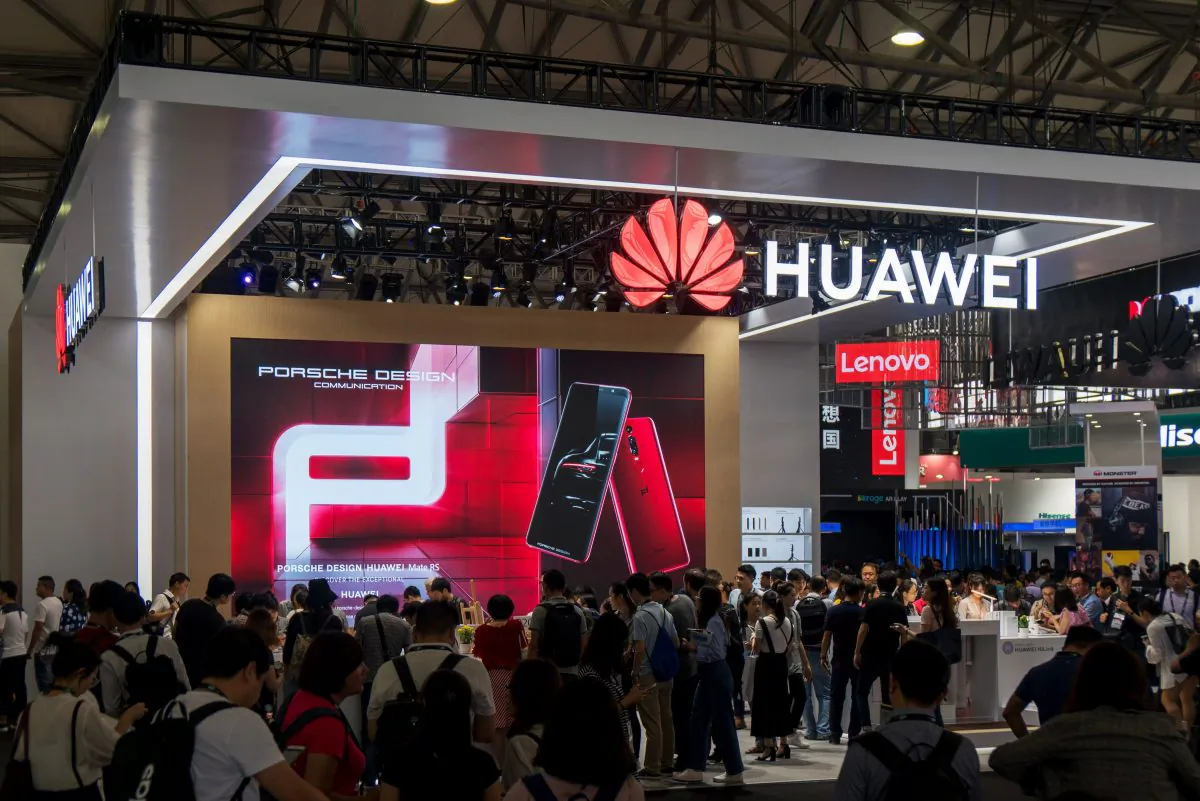 People gather at a Huawei stand during the Consumer Electronics Show (CES) Asia in Shanghai on June 13, 2018. (AFP/Getty Images)