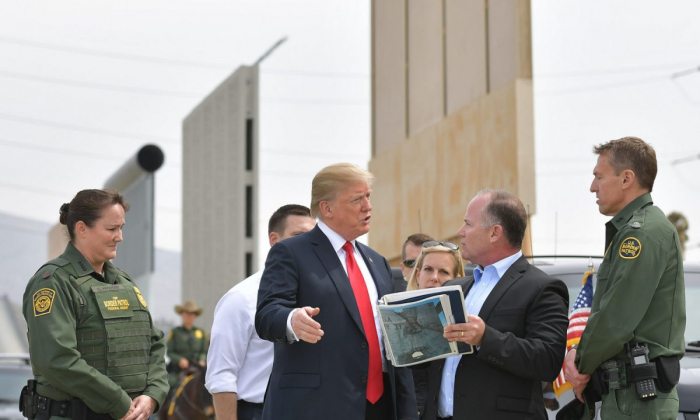 President Donald Trump (C) is shown border wall prototypes in San Diego, Calif., on March 13, 2018. (Mandel Ngan/AFP/Getty Images)