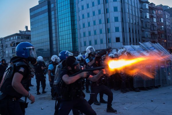 Riot police fire tear gas