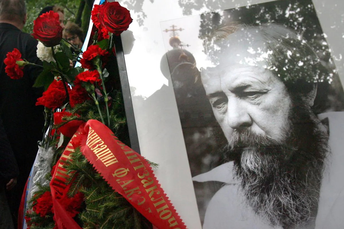 Roses stand at the gravesite of Russian author and dissident Alexander Solzhenitsyn in Moscow on Aug. 6, 2008. The Nobel Prize-winning Russian writer can help us remember the horrors of socialism, which seem to be being forgotten by many in America today. (NATALIA KOLESNIKOVA/AFP/Getty Images)