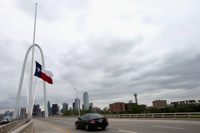 The Texas state flag flies at half staff at the Margaret Hunt Hill Bridge April 4, 2013 in Dallas, Texas. (Ronald Martinez/Getty Images)