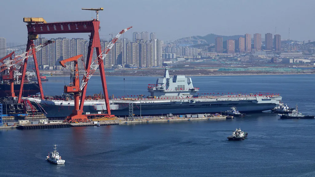 China's second aircraft carrier, is transferred from the dry dock into the water during a launch ceremony at Dalian shipyard in Dalian, northeast China's Liaoning Province, April 26, 2017. (Photo credit should read STR/AFP/Getty Images)