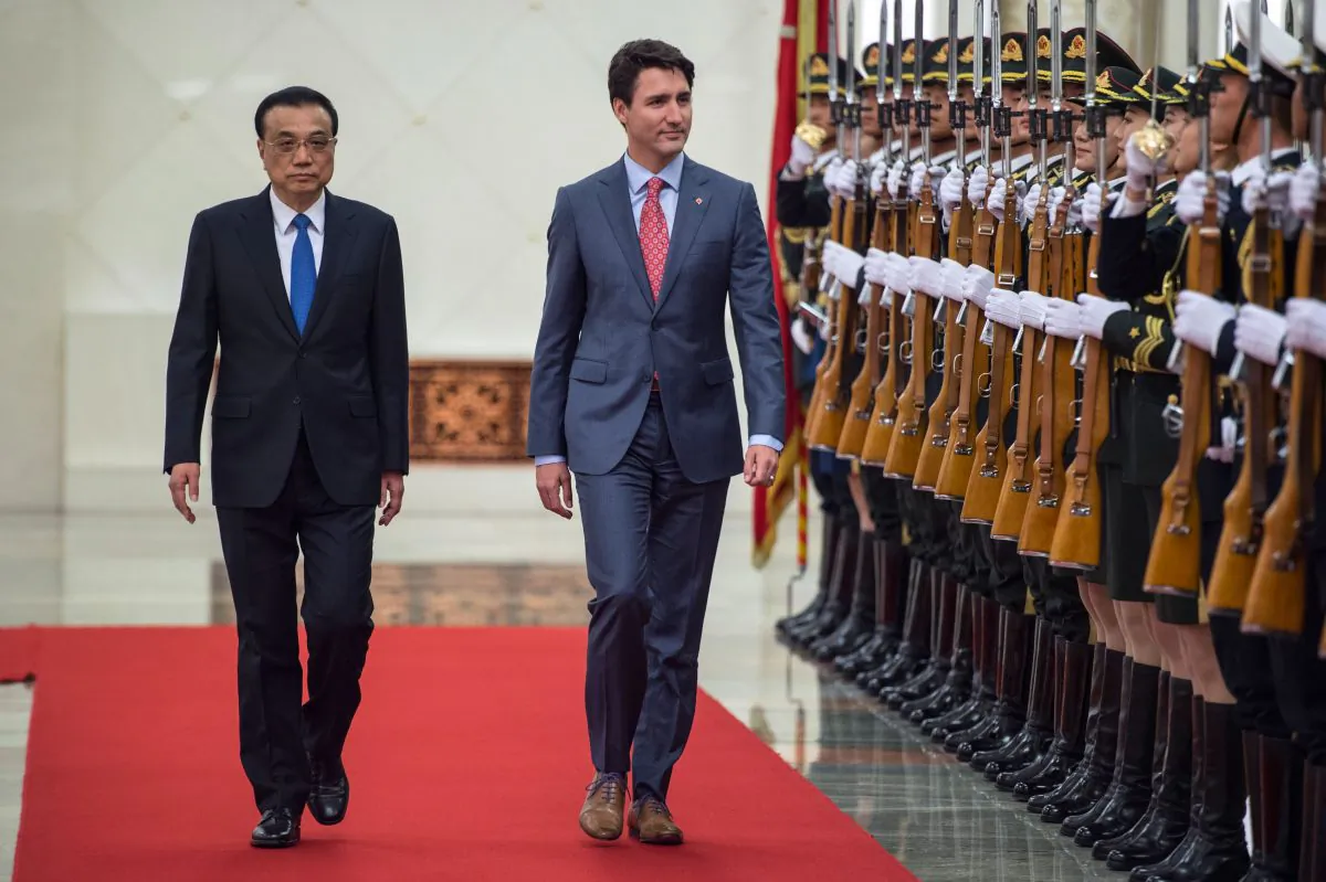 Canada's Prime Minister Justin Trudeau and China's Premier Li Keqiang walk during a review of Chinese paramilitary guards Beijing, China on Dec. 4, 2017. (Fred Dufour/AFP/Getty Images)