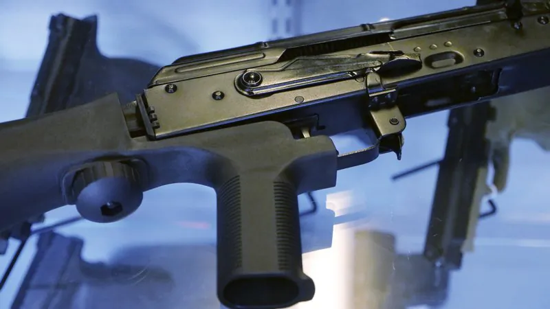 A little-known device called a "bump stock" is attached to a semi-automatic rifle at the Gun Vault store and shooting range in South Jordan, Utah on Oct. 4, 2017. (Rick Bowmer/AP Photo)

