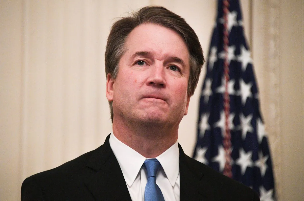 Brett Kavanaugh waits before being sworn-in as Associate Justice of the U.S. Supreme Court in the East room of the White House on Oct. 8, 2018. (Jim Watson/AFP/Getty Images)
