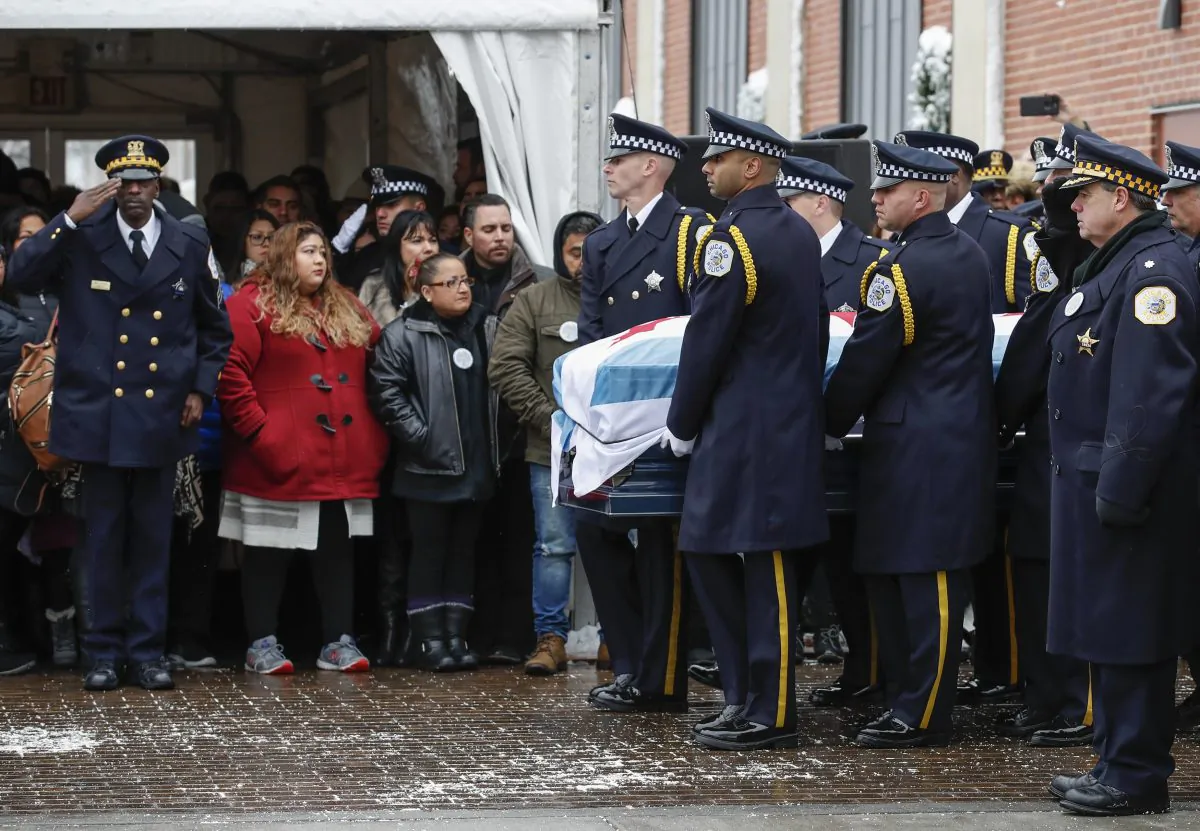 An honor guard carries the casket of slain Chicago Police Officer Samuel Jimenez to the hearse following funeral services at the Chapel of St Joseph at Shrine of Our Lady of Guadalupe in Des Plaines, Ill., on Nov. 26, 2018. (Kamil Krzaczynski/Getty Images)