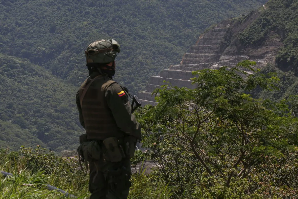 A Colombian soldier stands guard in a file photo. Six people were killed in the remote town of Mapiripán on Dec. 17, 2018. (Joaquin Sarmiento/AFP/Getty Images)