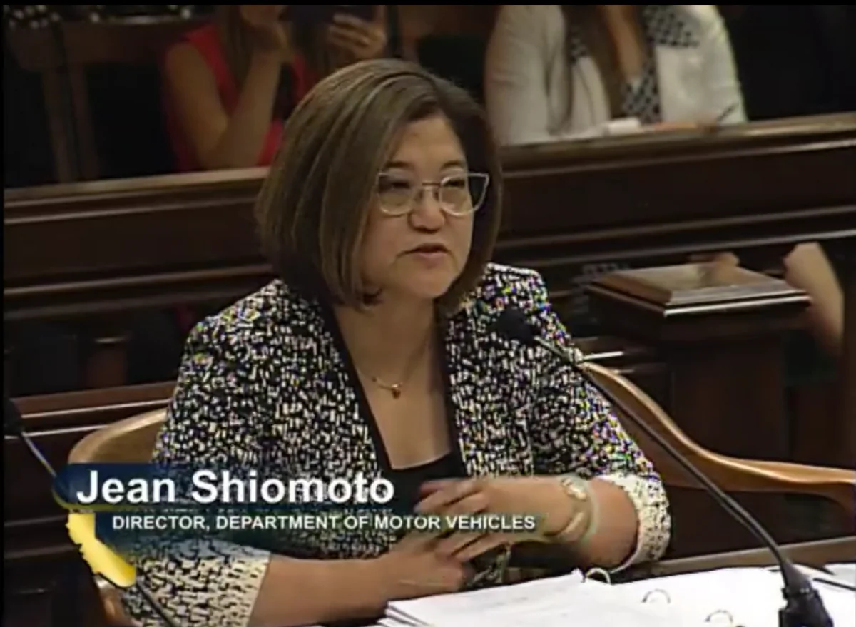 The California DMV Director Jean Shiomoto appeared at an Assembly hearing on Aug. 8, 2018 (Screenshot/California State Assembly Media Archives) 