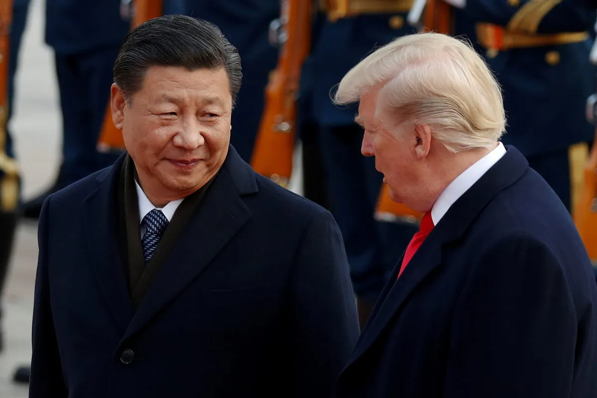 U.S. President Donald Trump takes part in a welcoming ceremony with Chinese leader Xi Jinping at the Great Hall of the People in Beijing on Nov. 9, 2017. (Damir Sagolj/Reuters)