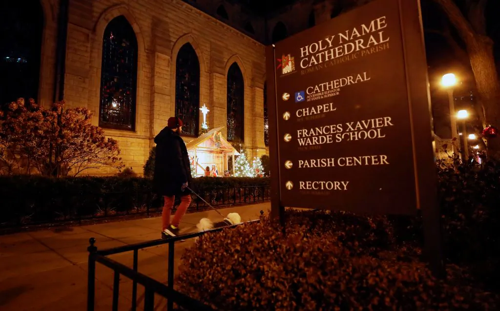 A man walks a dog past the Holy Name Cathedral in Chicago on Dec. 19, 2018. Almost 700 clergy in Illinois have been accused of child sexual assault, a far greater number than the Catholic Church had previously disclosed, the U.S. state's top prosecutor revealed on Dec. 19. (KAMIL KRZACZYNSKI/AFP/Getty Images)