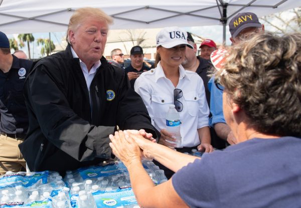 Trump and Melania hand out bottles of water in Florida.