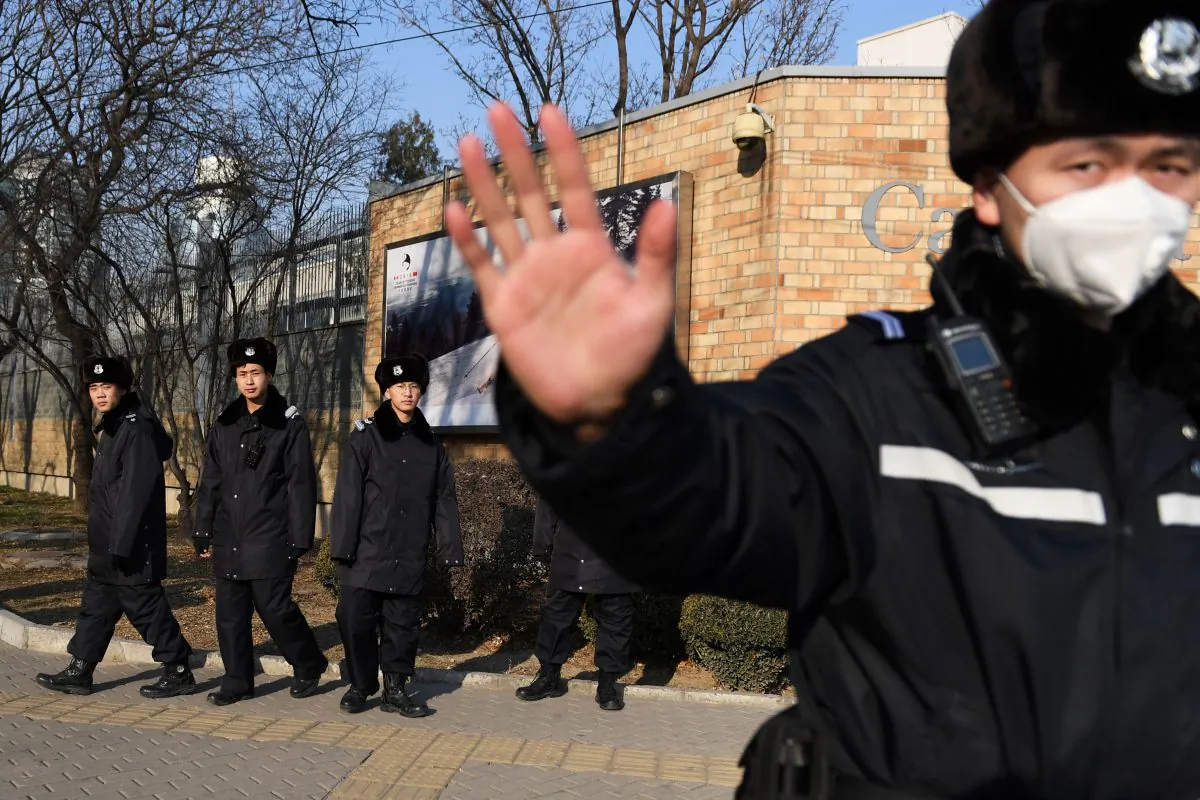 Chinese police patrol in front of the Canadian embassy in Beijing on December 14, 2018. (GREG BAKER/AFP/Getty Images)