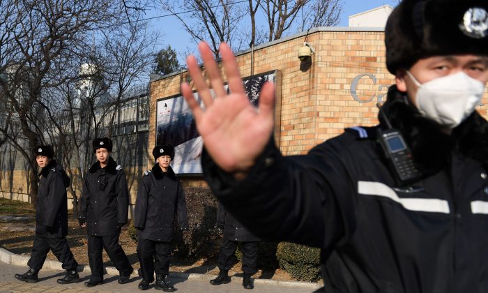 Chinese police patrol in front of the Canadian embassy in Beijing on December 14, 2018. (GREG BAKER/AFP/Getty Images)