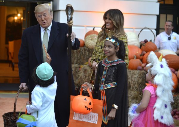Trump and Melania welcome trick-or-treaters to the White House.