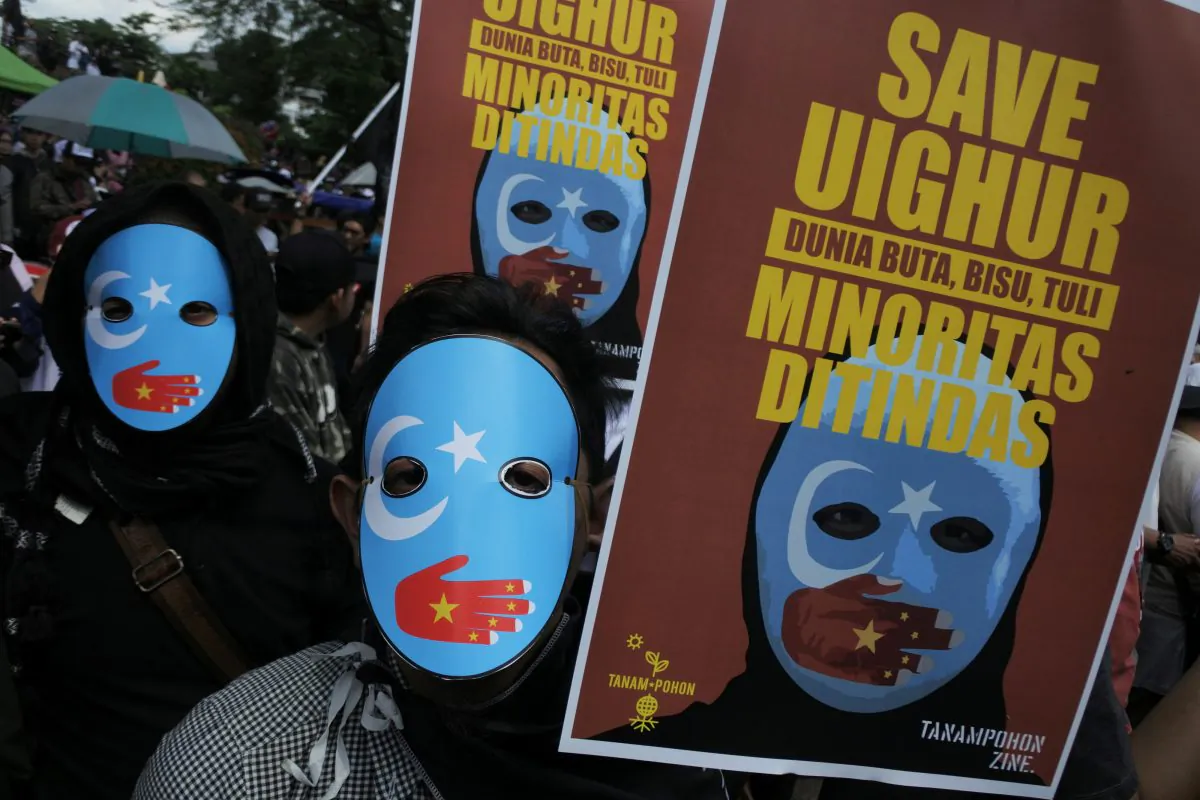 Protesters who are members of the Muslim Solidarity Movement hold placards during a protest against the violence and treatment of Uyghur Muslims by the Chinese Community Party in Bandung, West Java, Indonesia, on Dec. 21, 2018. (Antara Foto/Novrian Arbi/via Reuters)